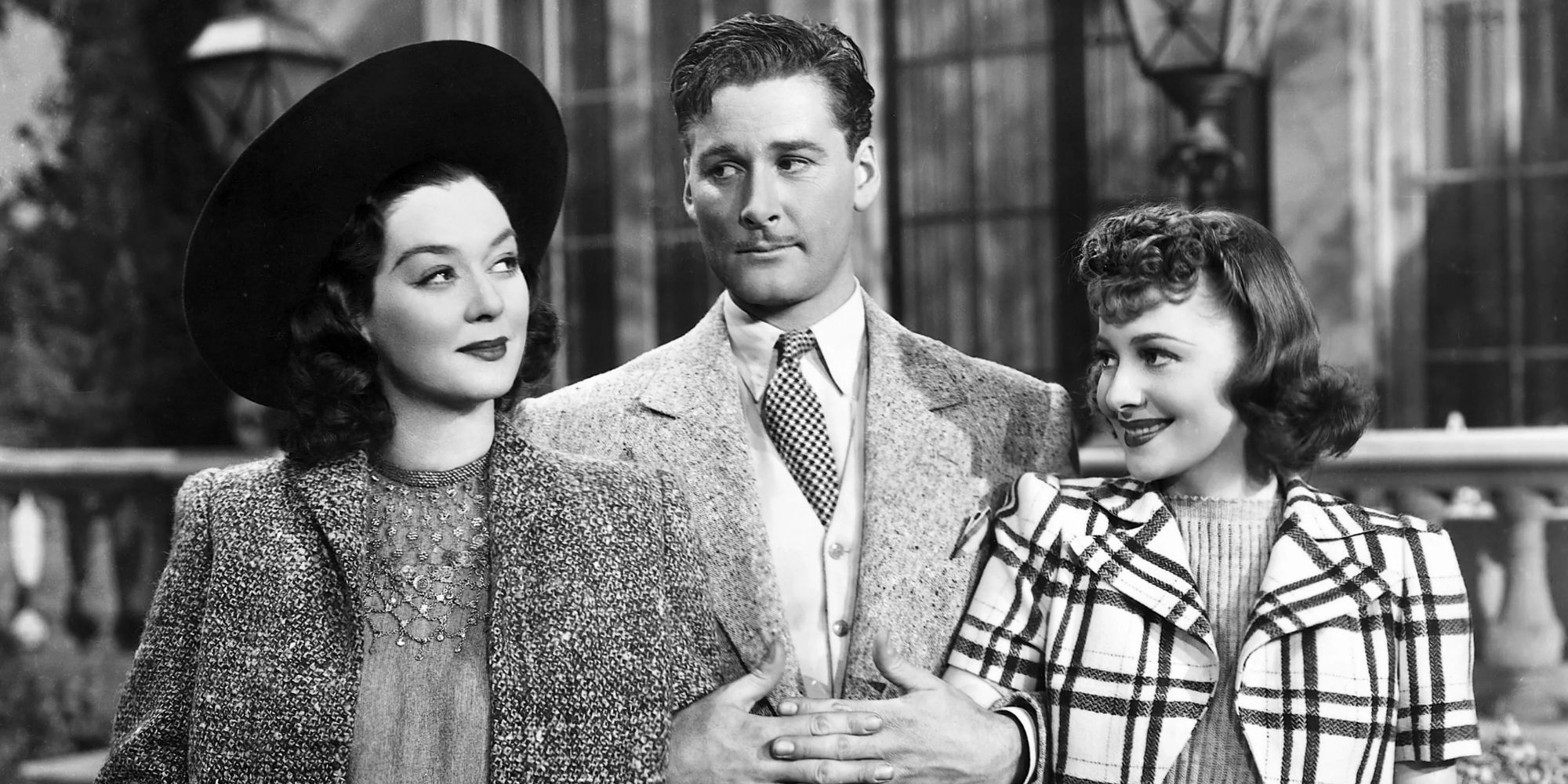 Rosalind Russell arm and arm with Errol Flynn on one of his arm and Olivia de Havilland on his other in Four&rsquo;s a Crowd (1938)