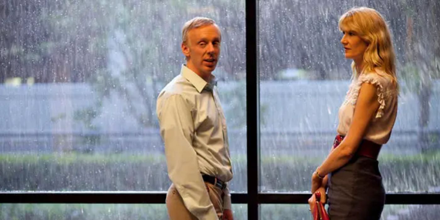 Mike White and Laura Dern as Tyler and Amy standing in front of a window pane in 'Enlightened'