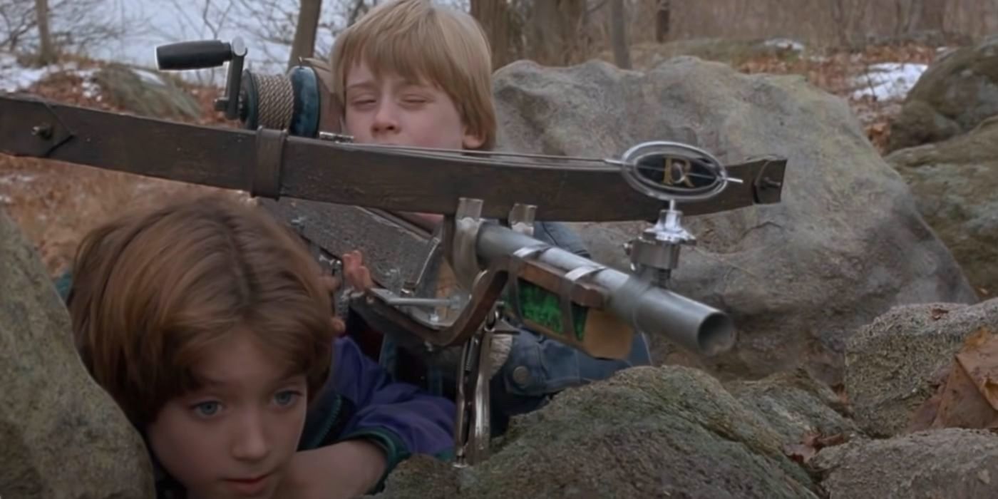 Mark (Elijah Wood) waits for his cousin Henry (Macaulay Culkin) to use a homemade nail gun in The Good Son.