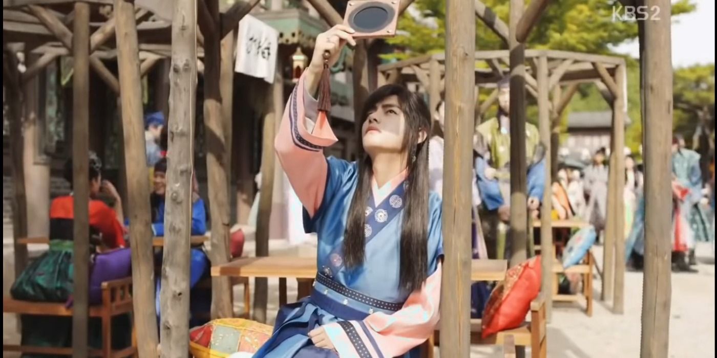 Kim Taehyung looking at the sun with a small binocular he made in Hwarang: The Poet Warrior Youth.