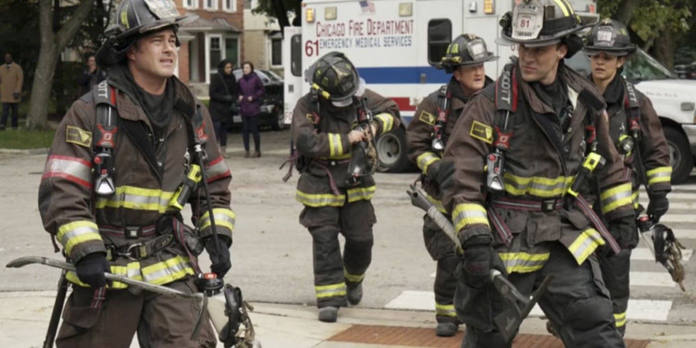 Severide (Taylor Kinney) and other firefighters on street in firegear in the 'Chicago Fire' episode "A Coffin That Small"