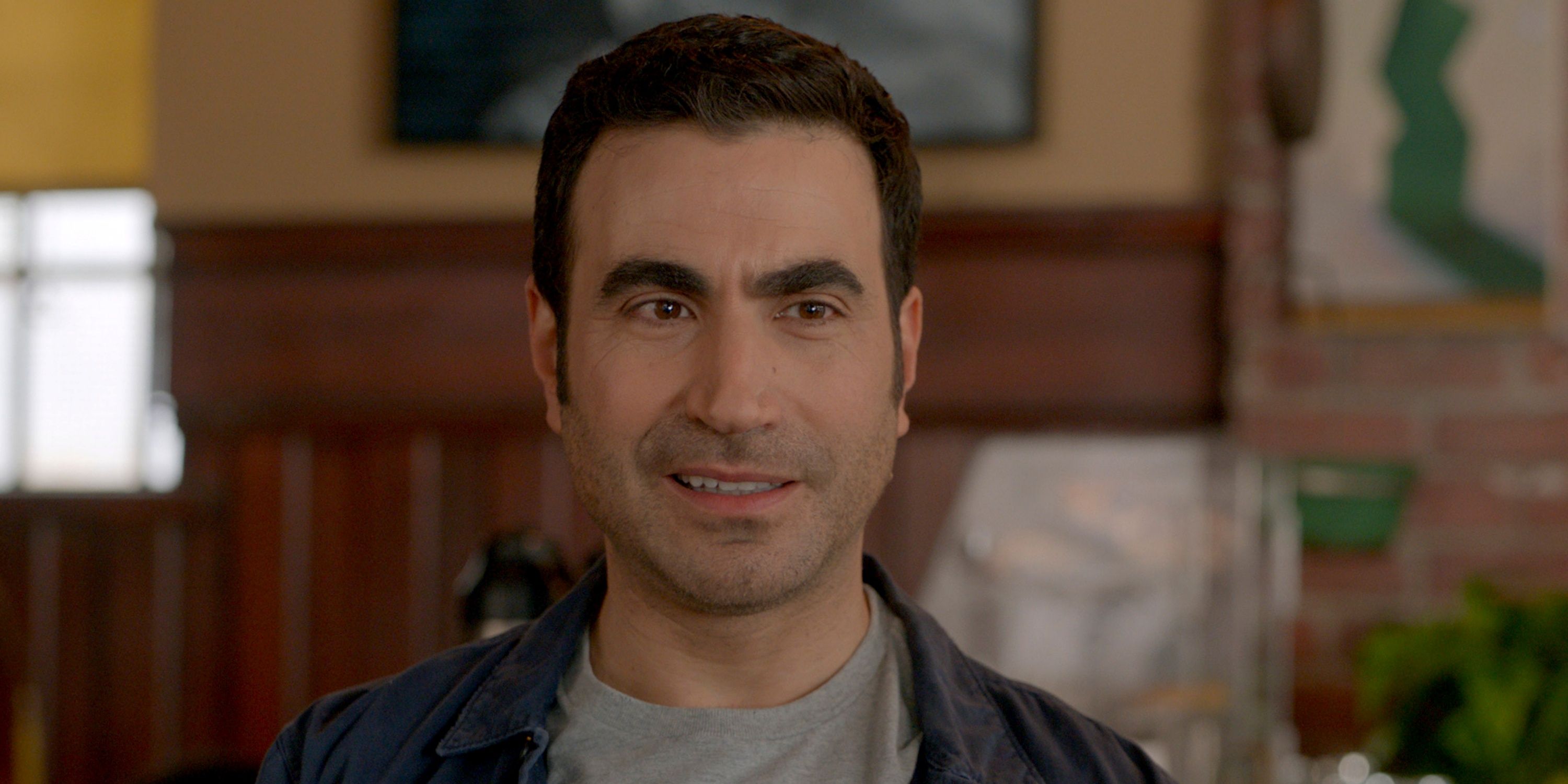 Brett Goldstein as Louis with a small smile in Season 2 of Shrinking