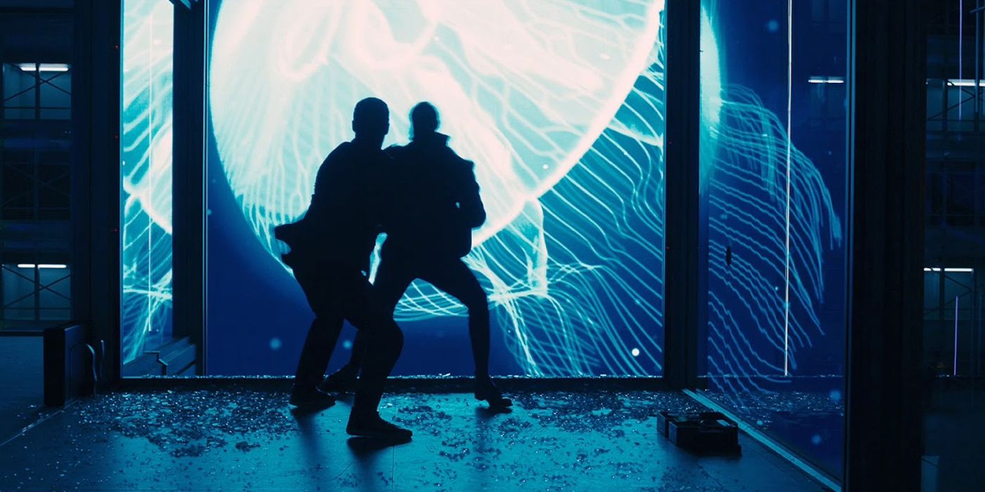 James Bond fights a henchman against a Shanghai neon backdrop in Skyfall