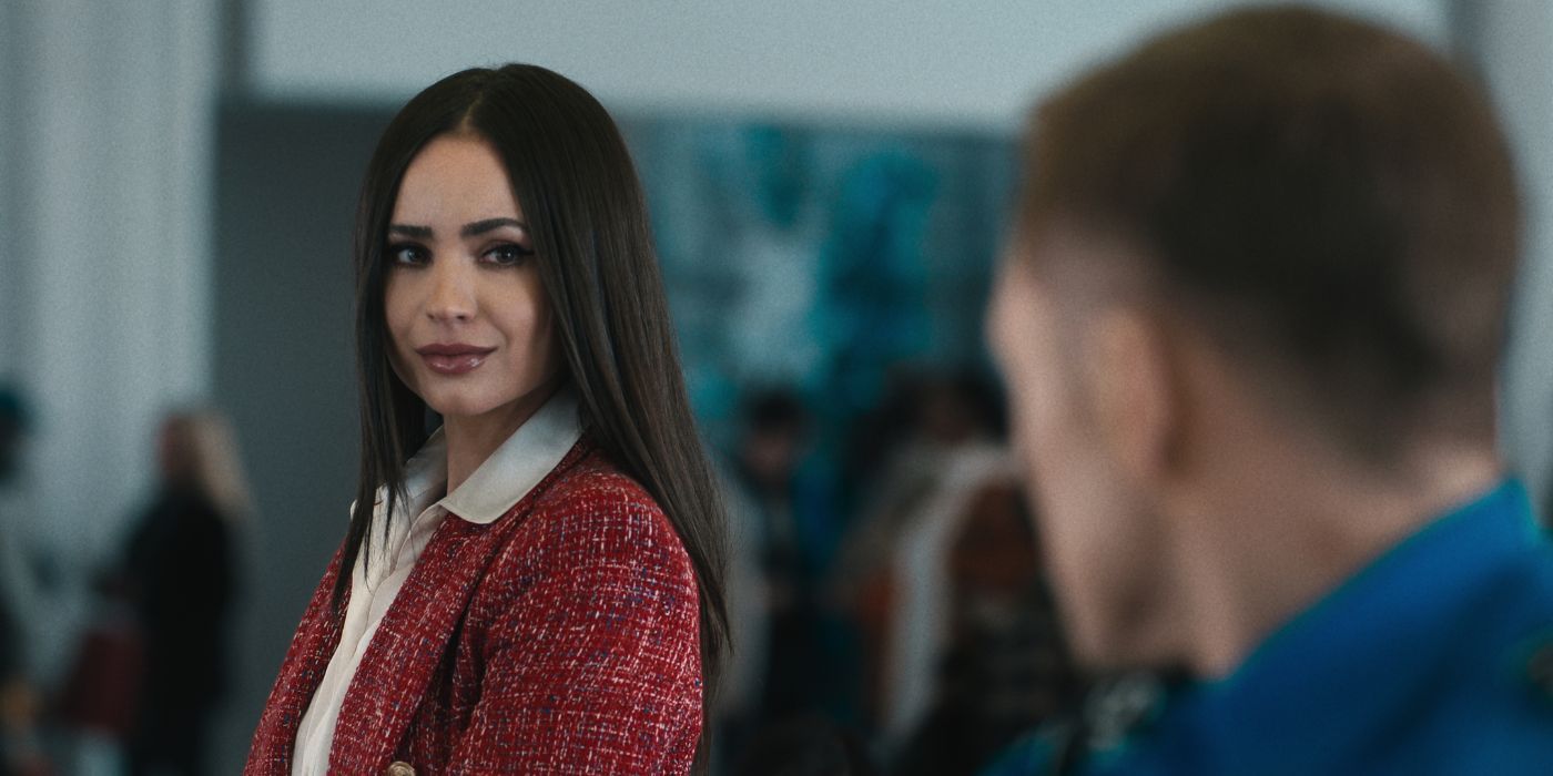 Sofia Carson as Nora looking at someone in Carry-On.