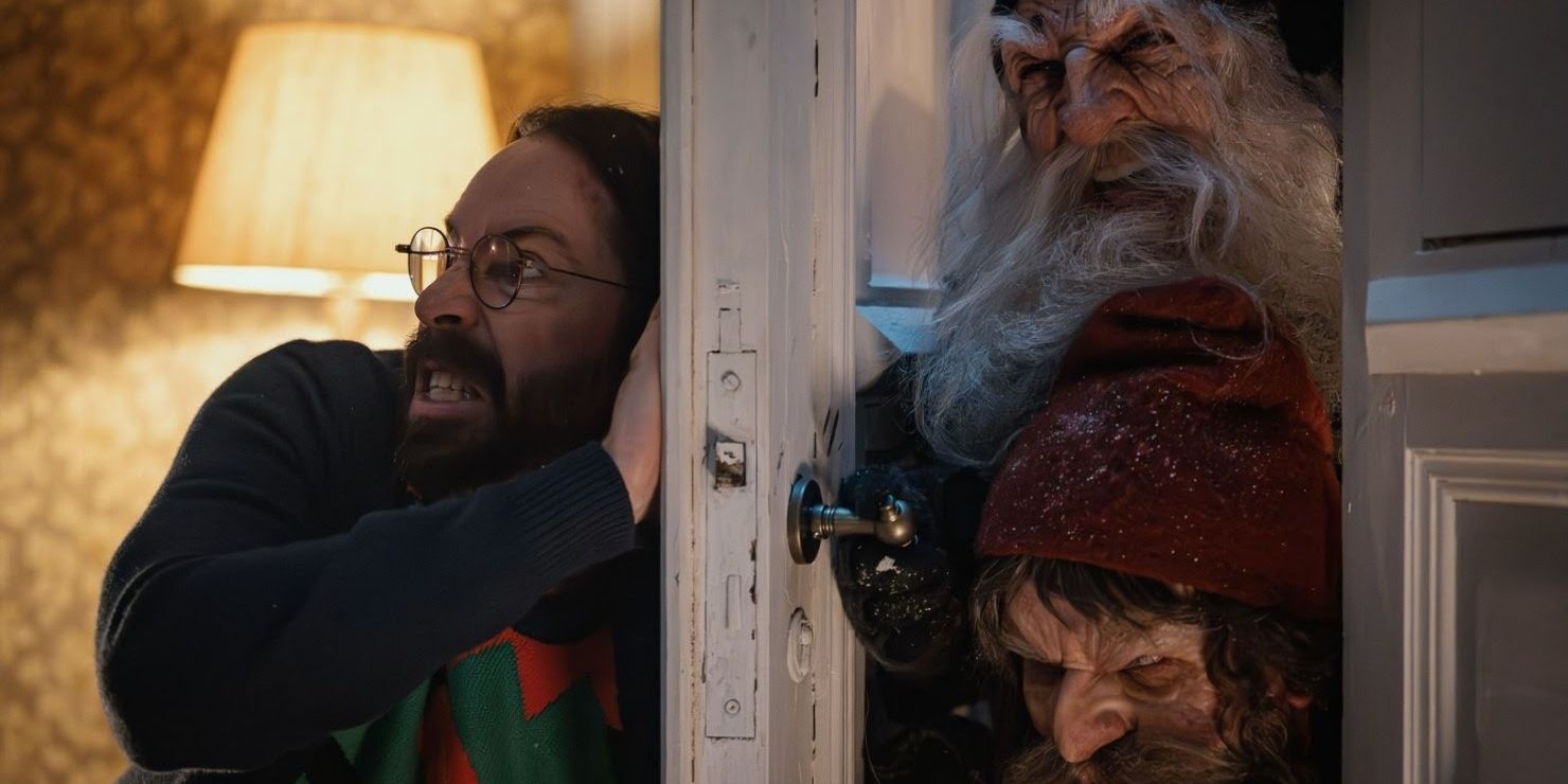 Bill, played by actor Martin Starr, tries to hold a door shut while two evil-looking elves come crashing through it in There's Something in the Barn.