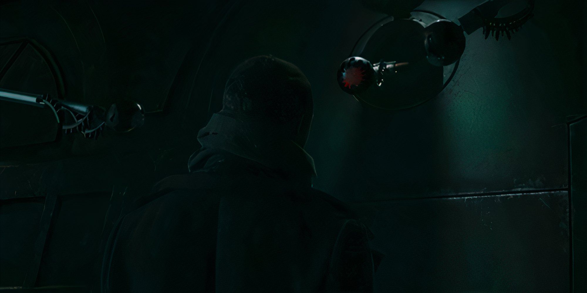 Jod Na Nawood (Jude Law) stands in front of three TT-8L/Y7 gatekeeper droids in Star Wars: Skeleton Crew