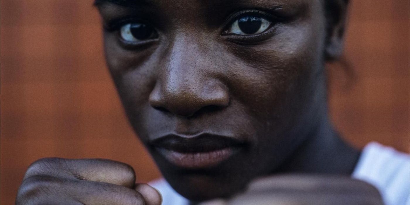 Boxer Claressa Shields in close-up with her fists up in the documentary T-Rex: Her Fight for Gold