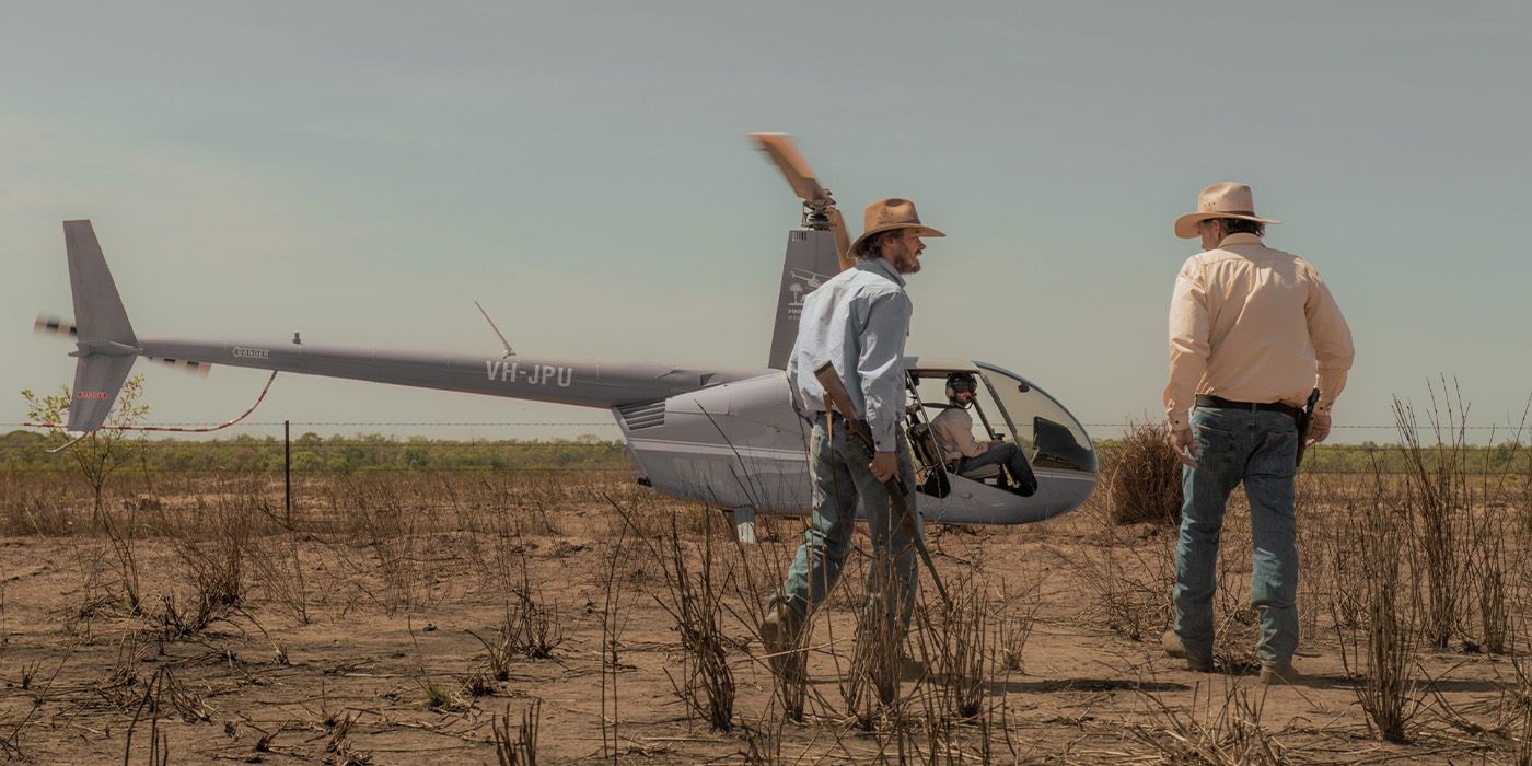 Graham Lawson (Michael Dorman) yells at Colin Lawson (Robert Taylor) beside a helicopter on &lsquo;Territory&rsquo;