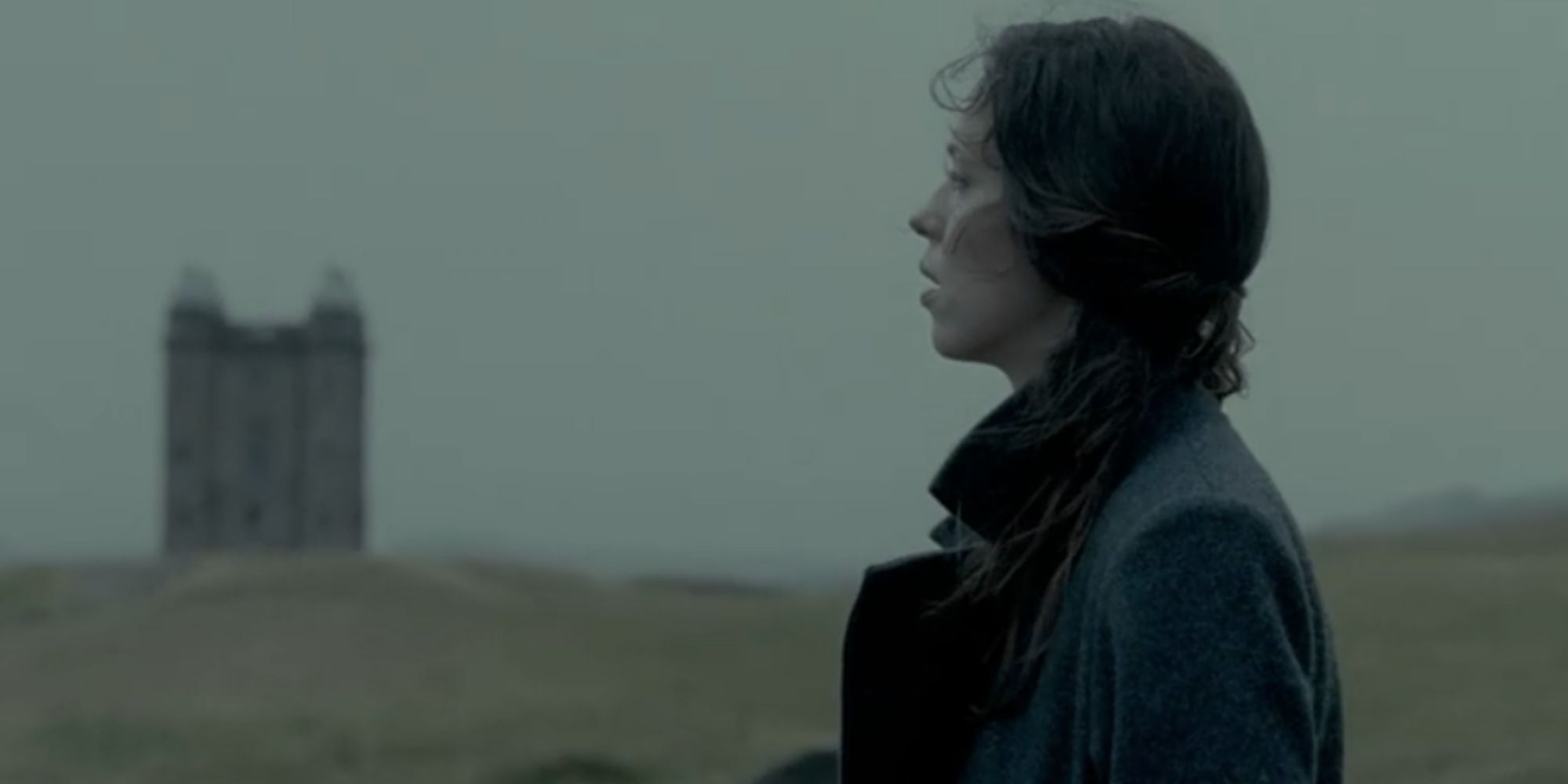 Florence, played by Rebecca Hall, stands outside a boys' boarding school in The Awakening.
