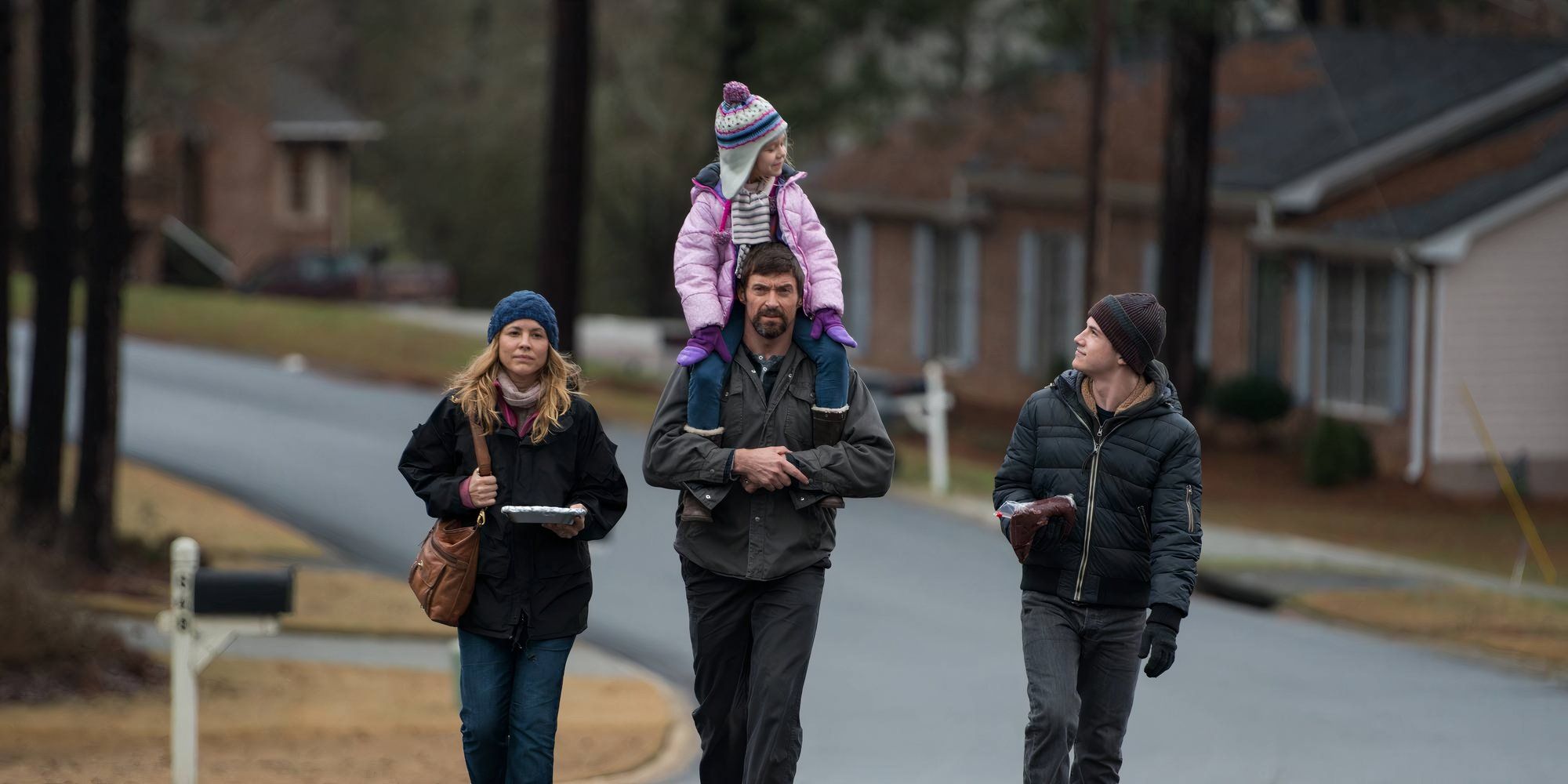 The cast of Prisoners walking side by side