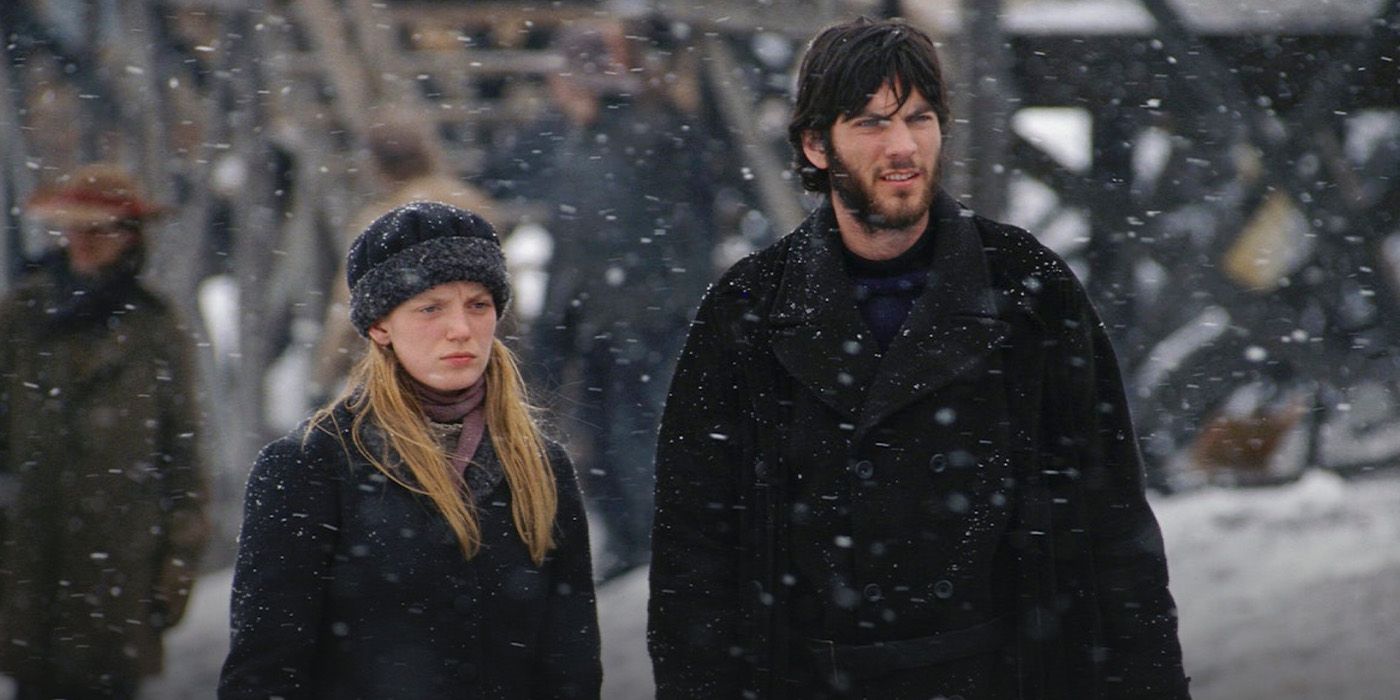 Hope Burns/Dillon (Sarah Polley) and Donald Dalglish (Wes Bentley) stand in the snow in 'The Claim'