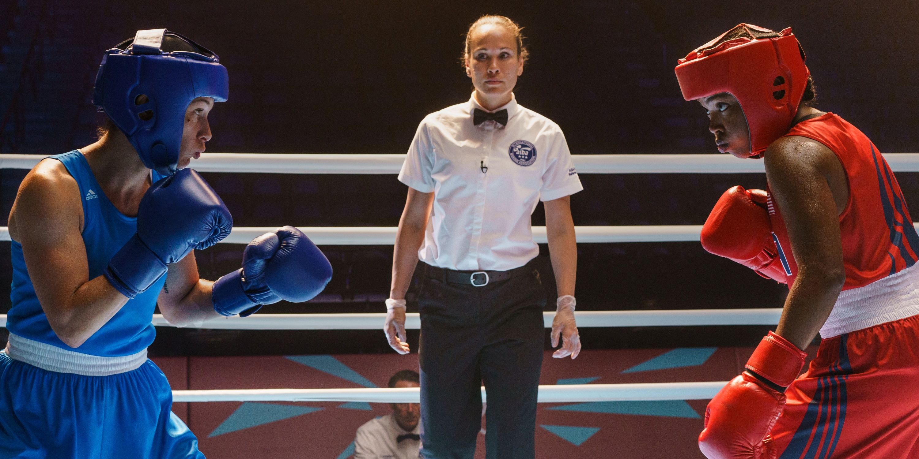 Ryan Destiny as boxer Claressa Shields suited up in red in the boxing ring in The Fire Inside