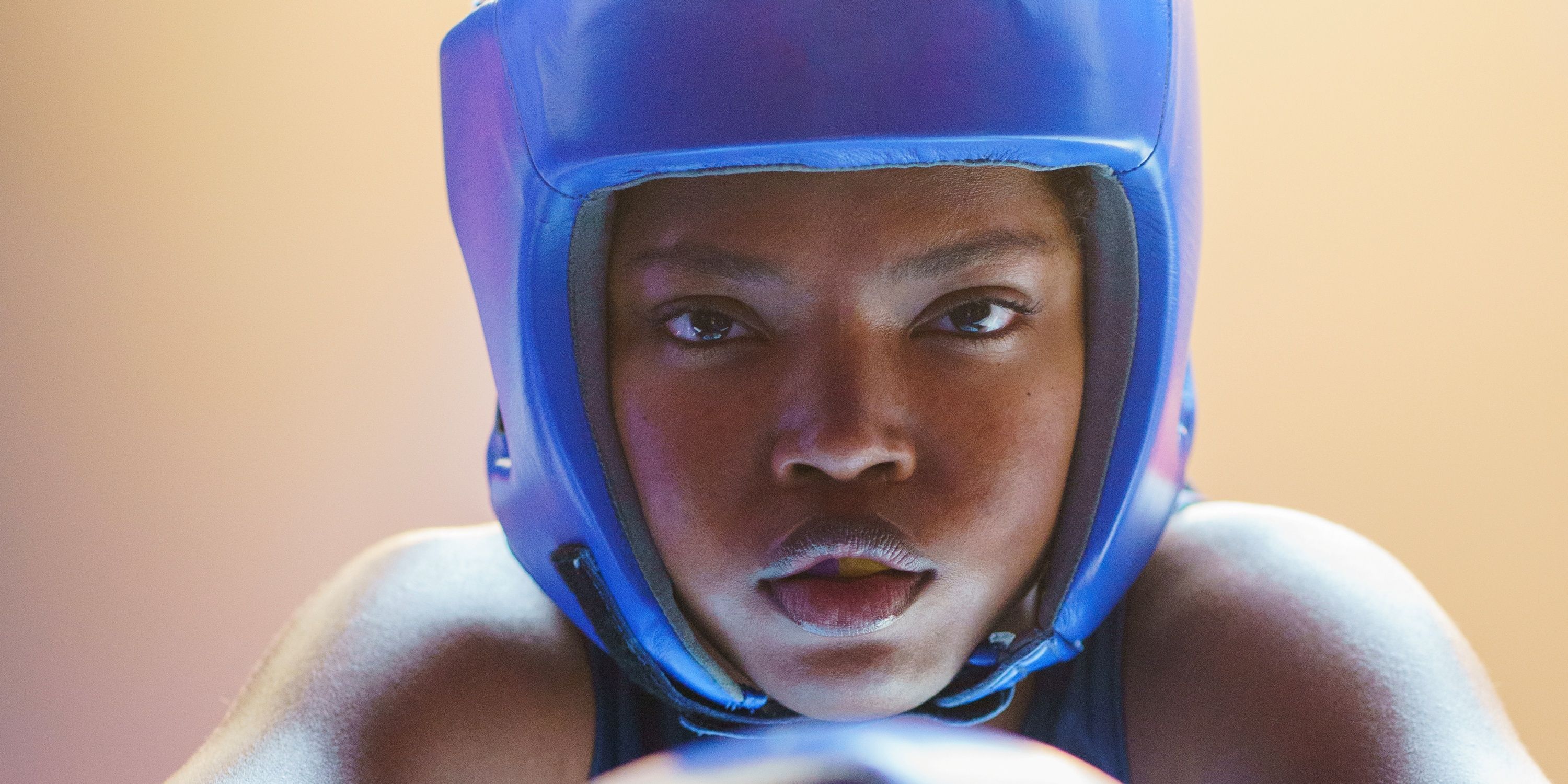 Ryan Destiny as boxer Claressa Shields suited up in blue for a fight in The Fire Inside