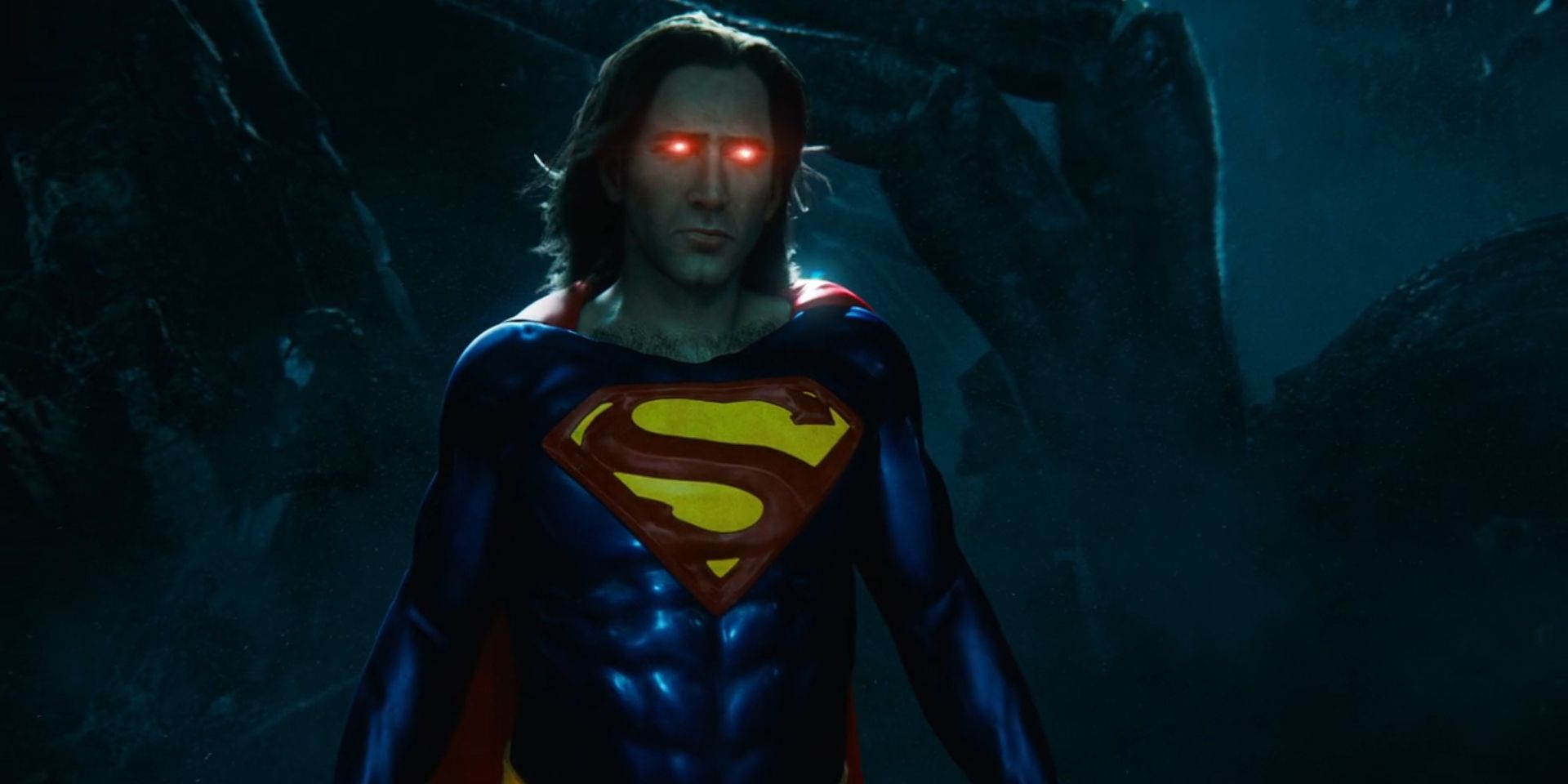 A version of Superman played by Nicolas Cage looks upset while his eyes glow red in 'The Flash'.