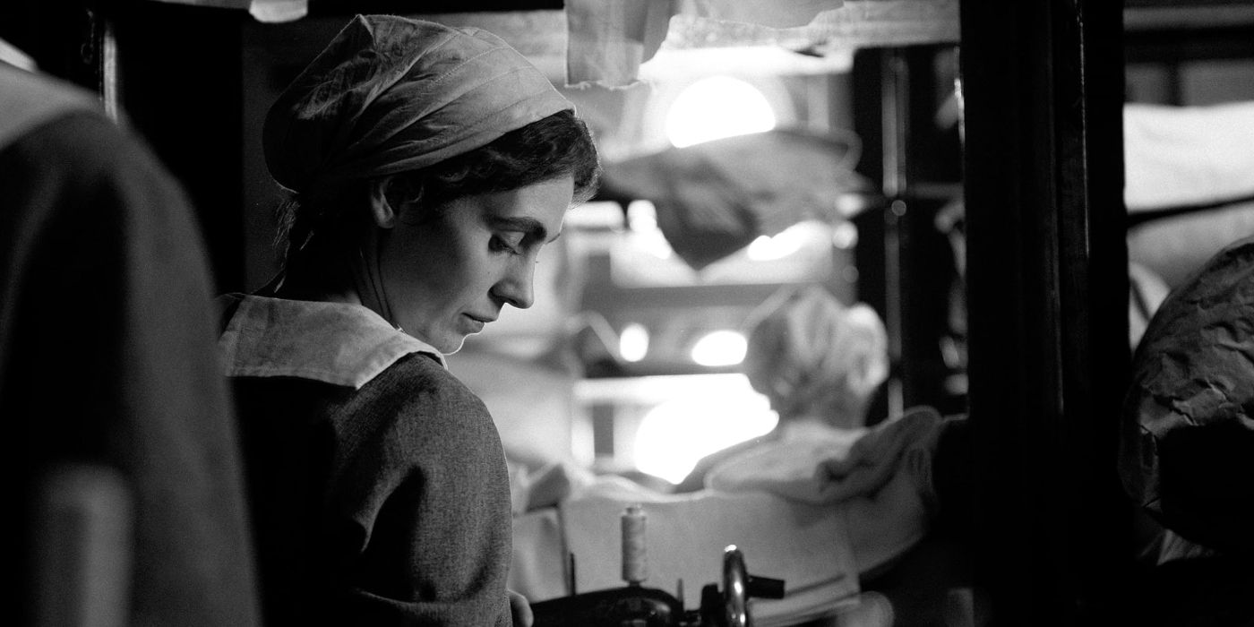 Vic Carmen Sonne as Karoline doing household duties in The Girl with the Needle