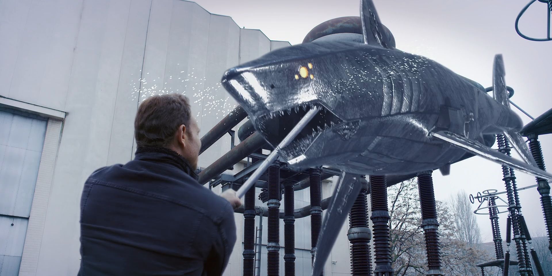 Fin Shepard, played by Ian Ziering, shoves a pole into the mouth of a floating robotic shark in &lsquo;The Last Sharknado: It&rsquo;s About Time&rsquo;.