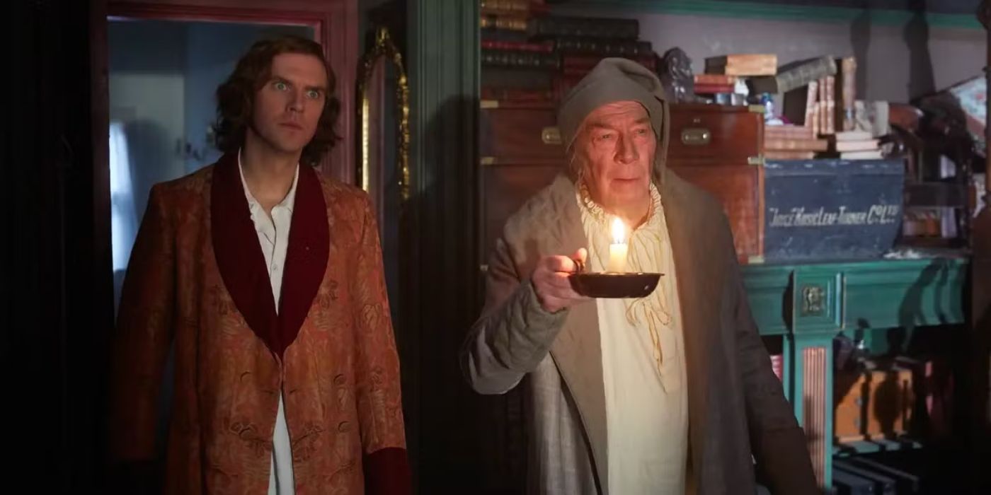 Christopher Plummer as Scrooge next to Dan Stevens as Charles Dickens in The Man Who Invented Christmas.