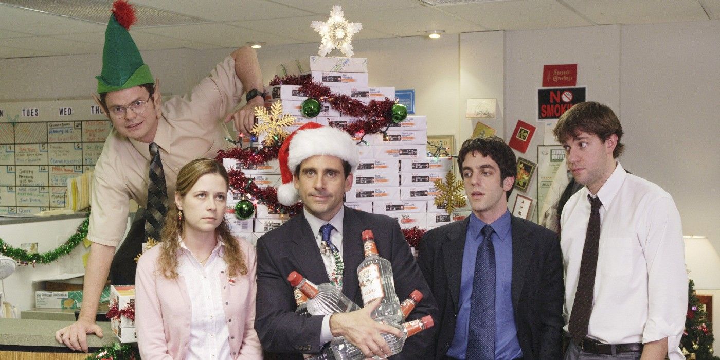 The cast of 'The Office' in front of a stack of paper for "The Christmas Party"