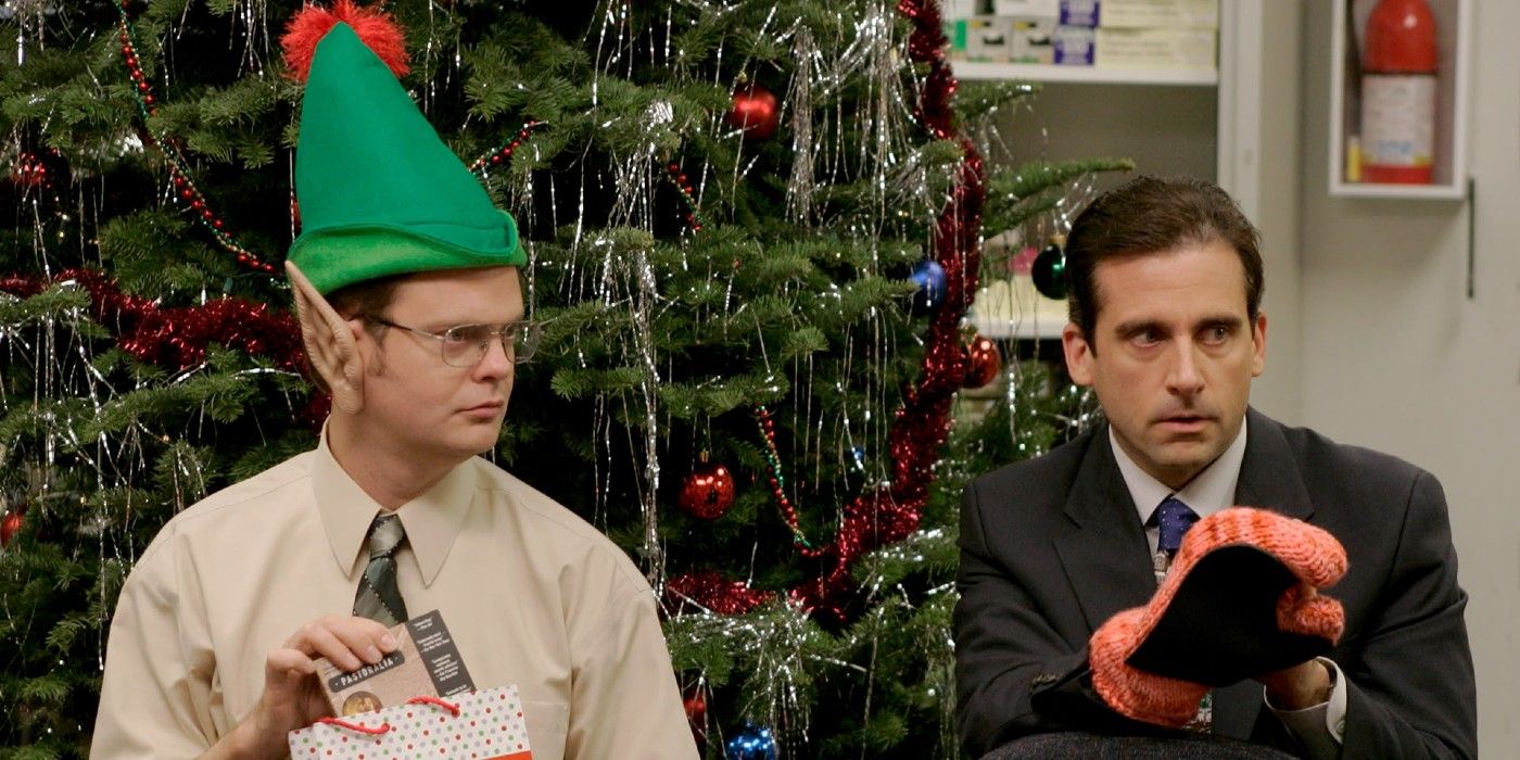 Dwight and Michael in front of a Christmas tree in 'The Office' episode "The Christmas Party"