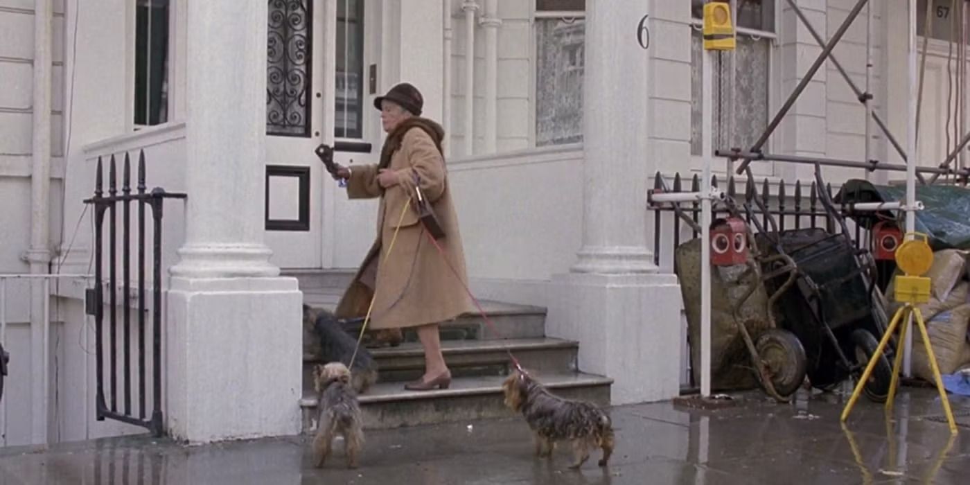 An old lady exiting her house with three small dogs on a leash in 'A Fish Called Wanda'