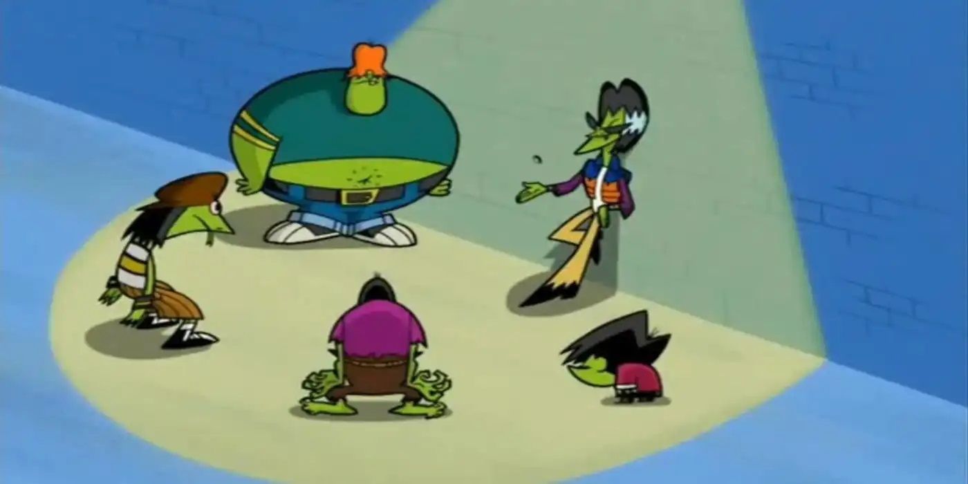 The Gangreen Gang standing in a circle under a spotlight