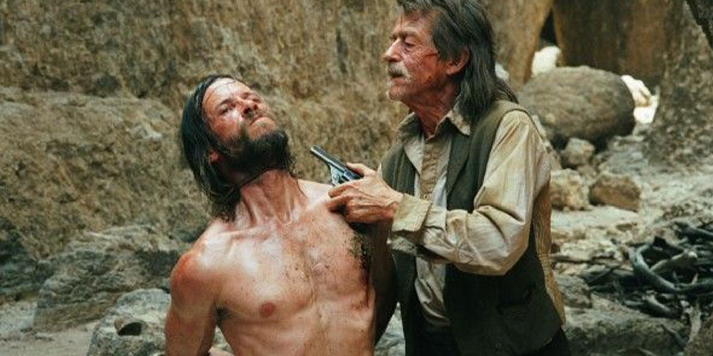 Charlie Burns (Guy Pearce) is threatened by Jellon Lamb (John Hurt) in 'The Proposition'