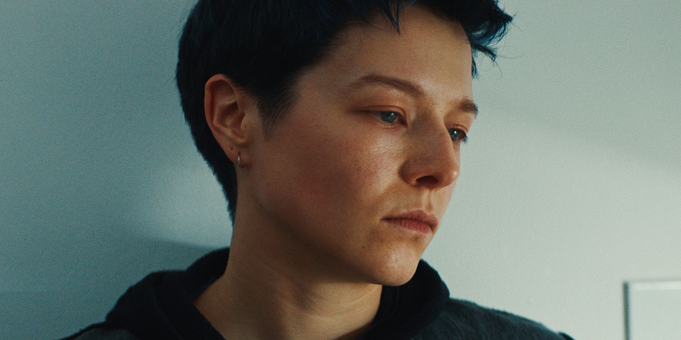 A close up of Emma D'Arcy looking to the side in The Talent