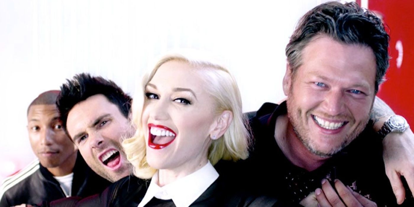 Gwen Stefani, Blake Shelton, Adam Levine, and Pharrell Williams laugh in a candid photo for The Voice.