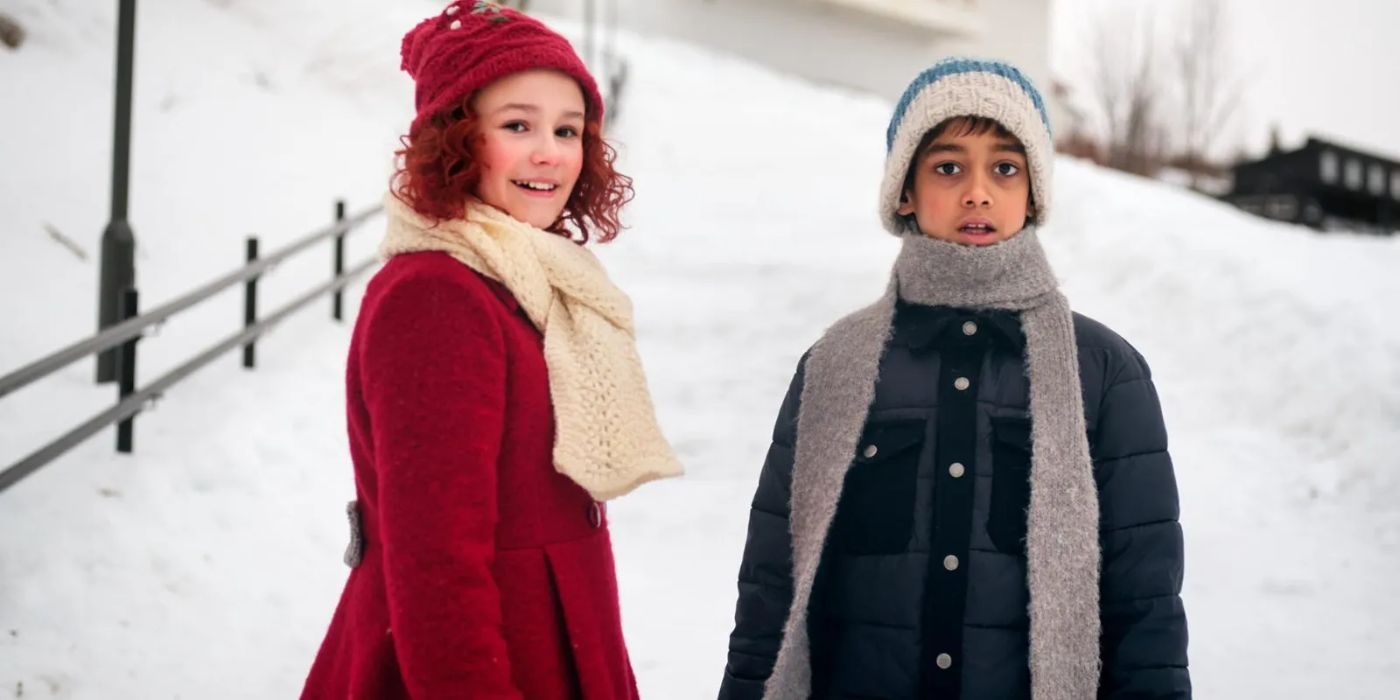 The two main characters of 'the snow sister', a boy and a girl against a snowy backdrop