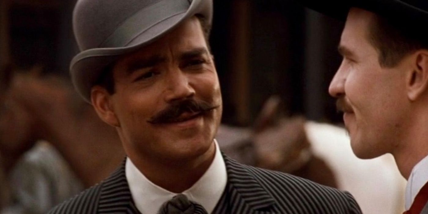 Sheriff Johnny Behan (Jon Tenny) talks with Doc Holliday (Val Kilmer) in 'Tombstone.'