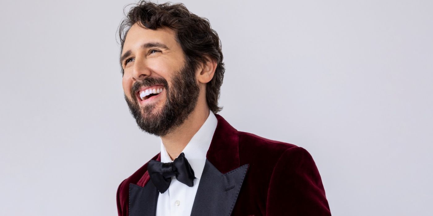 Josh Groban smiling in promo for 'Josh Groban and Friends Go Home for the Holidays'.