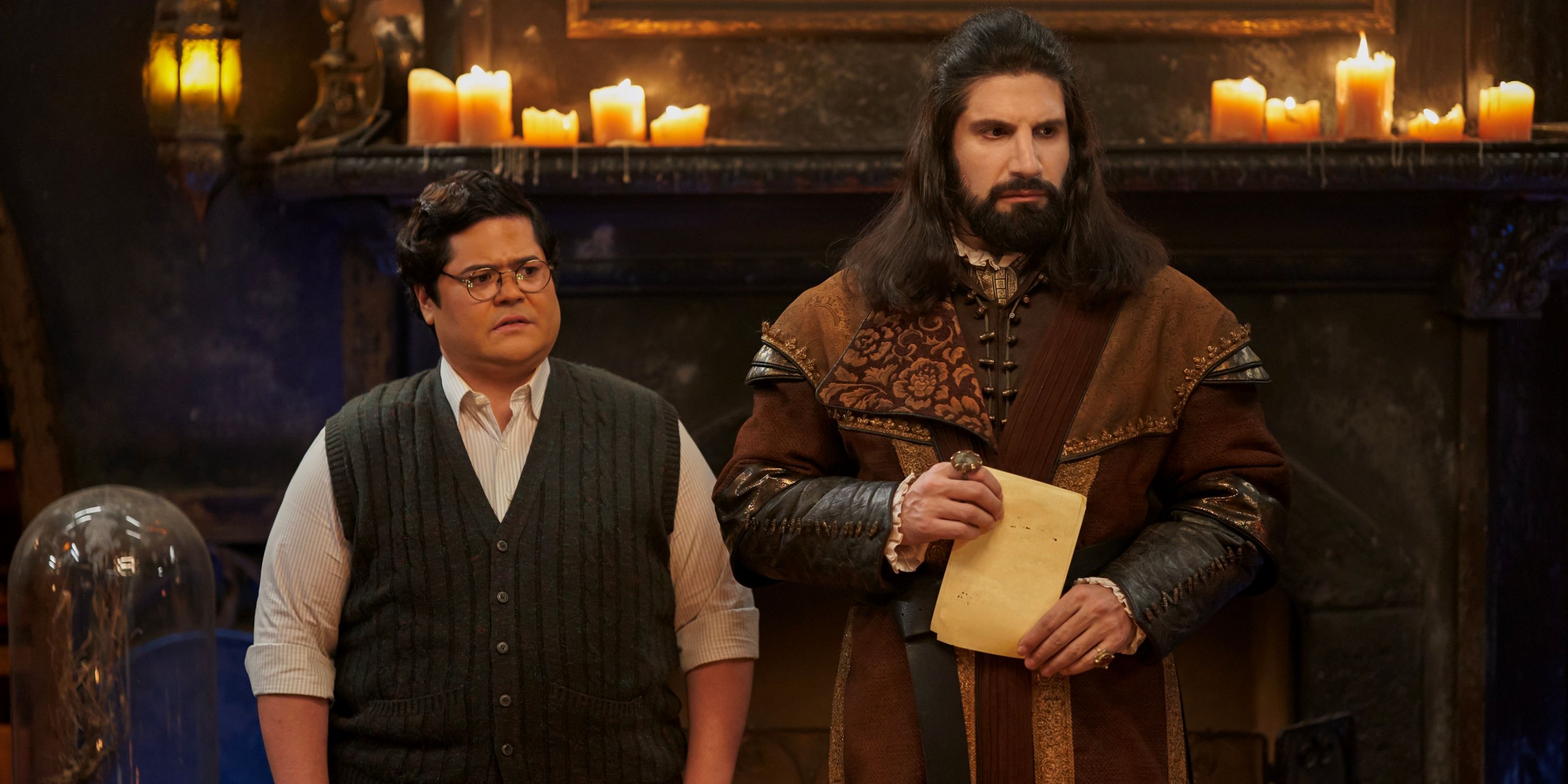 Harvey Guillén as Guillermo standing next to Kayvan Novak as Nandor in What We Do in the Shadows Season 6