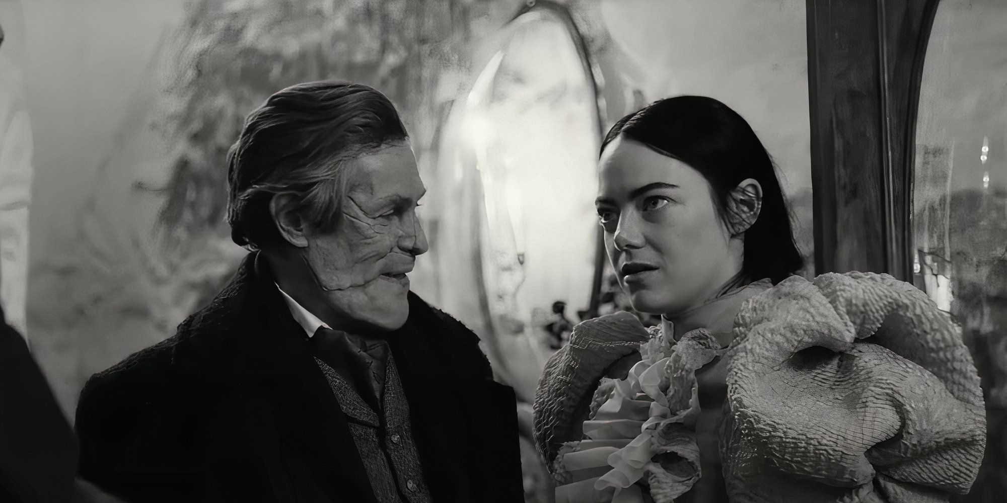 Willem Dafoe as God looks at Emma Stone as Bella in Poor Things.