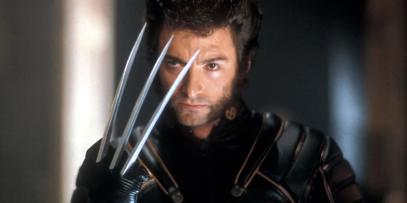 Wolverine (Hugh Jackman) holds up his fist as three long, sharp claws extend from it in 'X-Men' (2000).