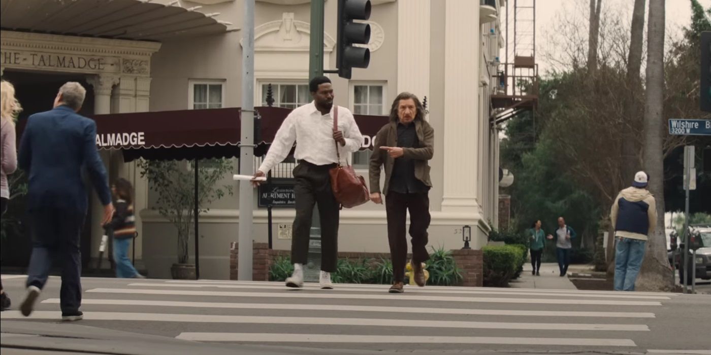 Yahya Abdul Mateen II and Ben Kingsley, crossing the street, as Simon Williams and Trevor Slattery in Wonder Man