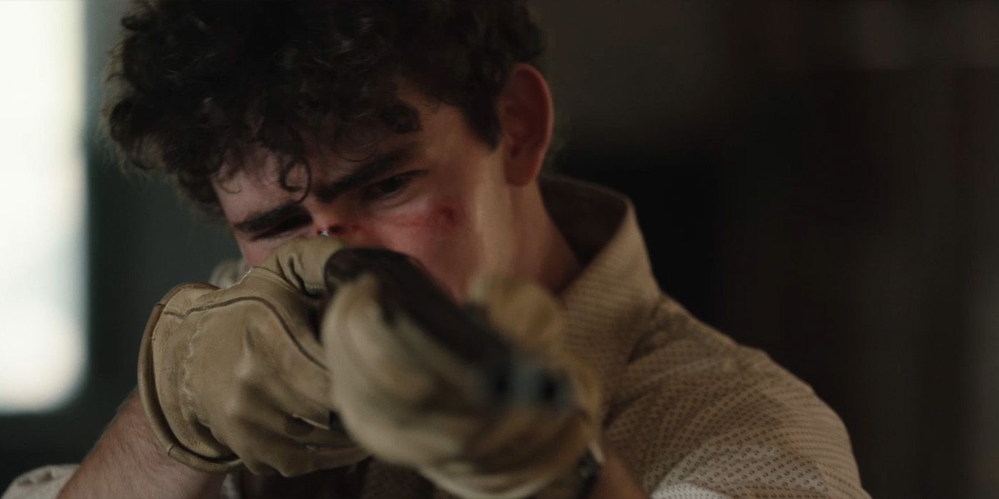Carter (Finn Little) holding a rifle in Yellowstone Season 5 Episode 12