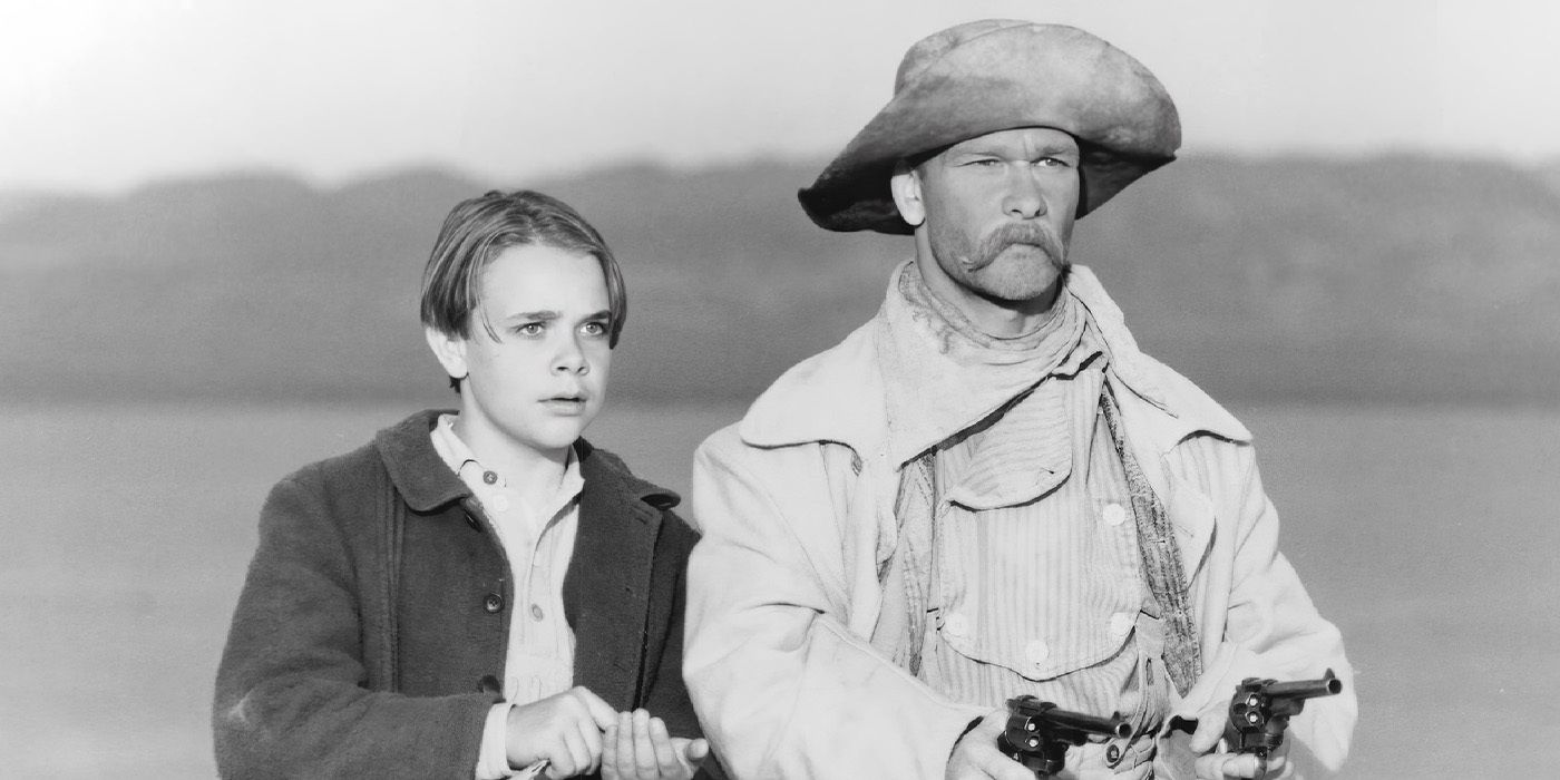 Daniel Hackett (Nick Stahl) stands beside an armed Pecos Bill (Patrick Swayze) in &lsquo;Tall Tale&rsquo;