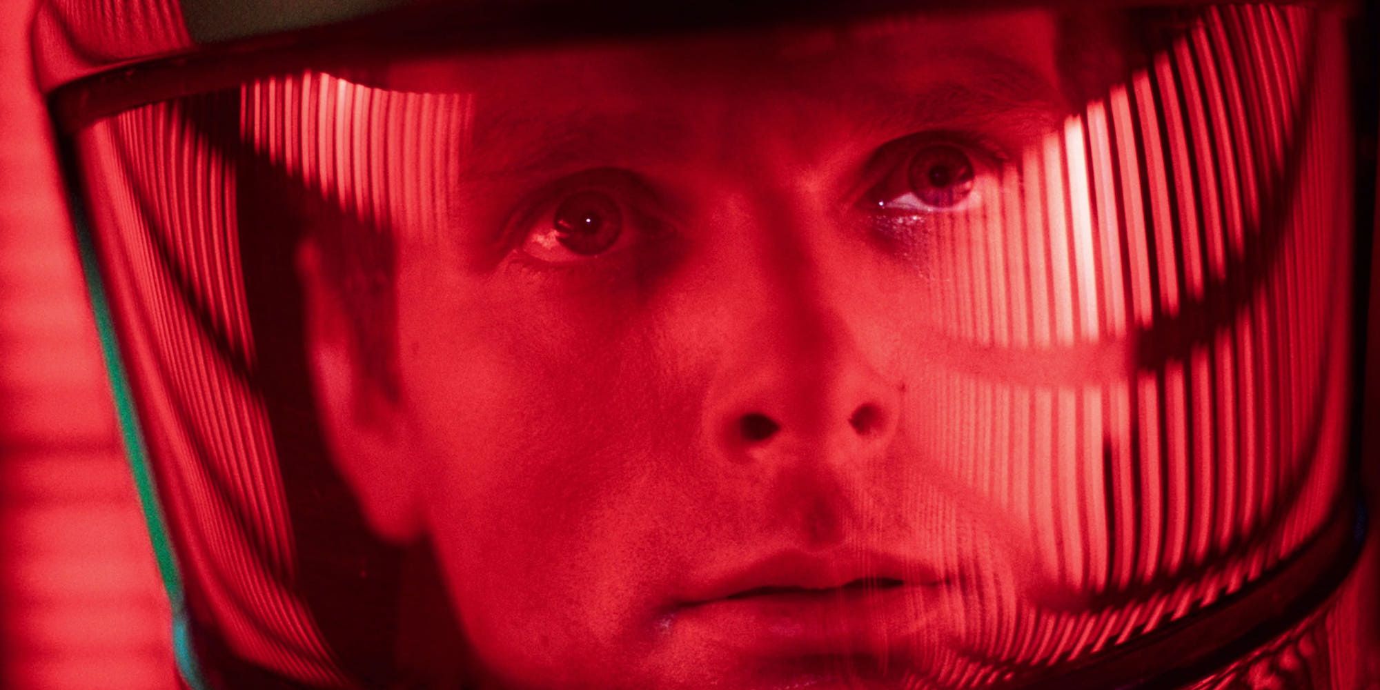 An astronaut under a red light looking ahead in 2001- A Space Odyssey 