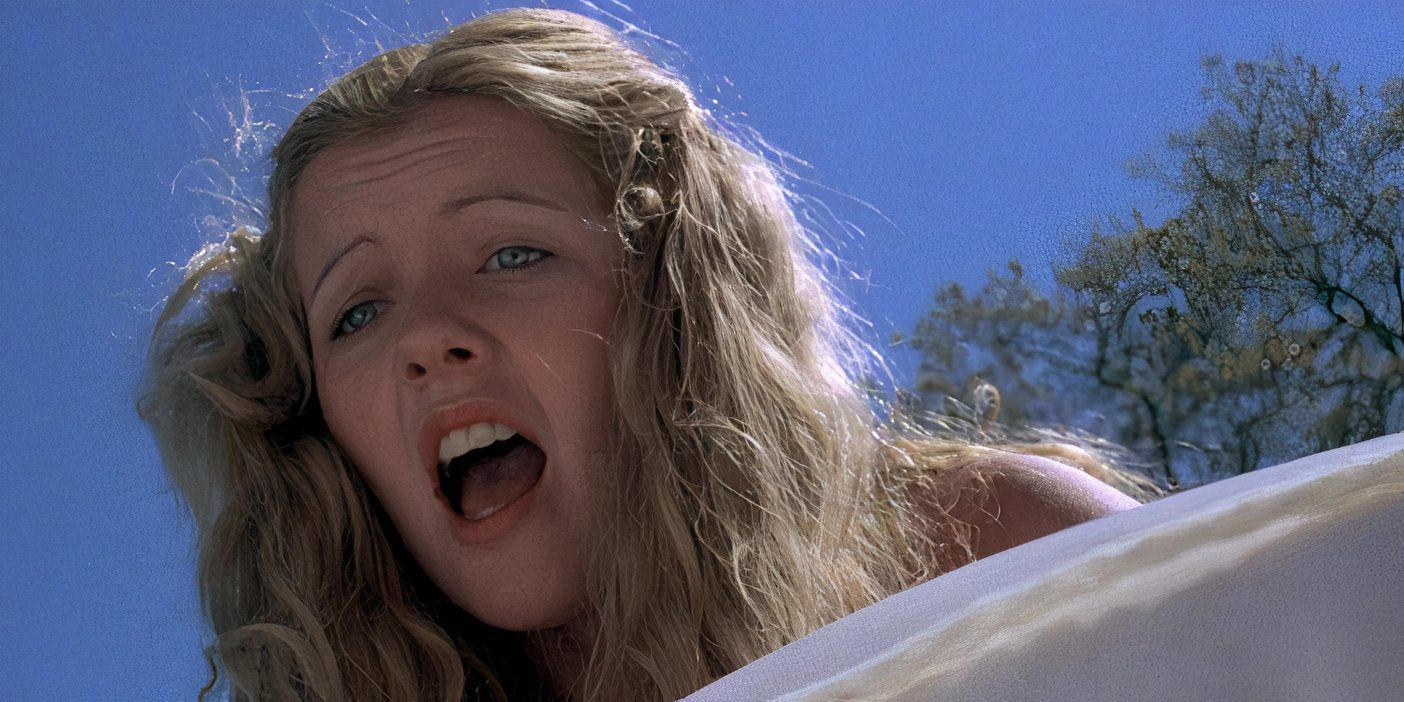 A woman looks distraught in Piranha