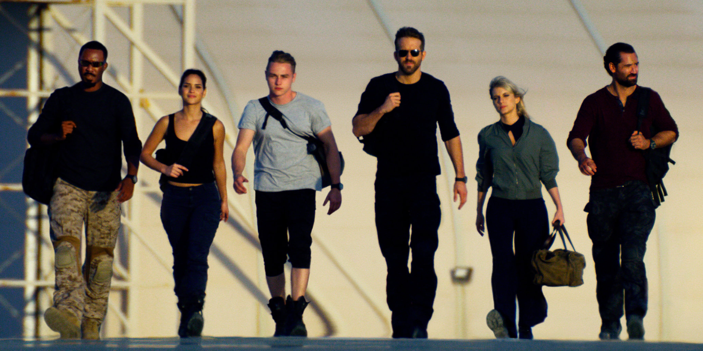 The 6 Underground team walks together in a straight line.