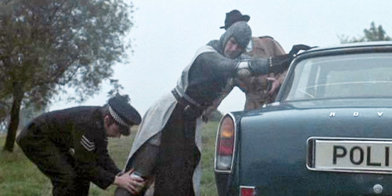 A cop arresting a knight in 'Monty Python and the Holy Grail'