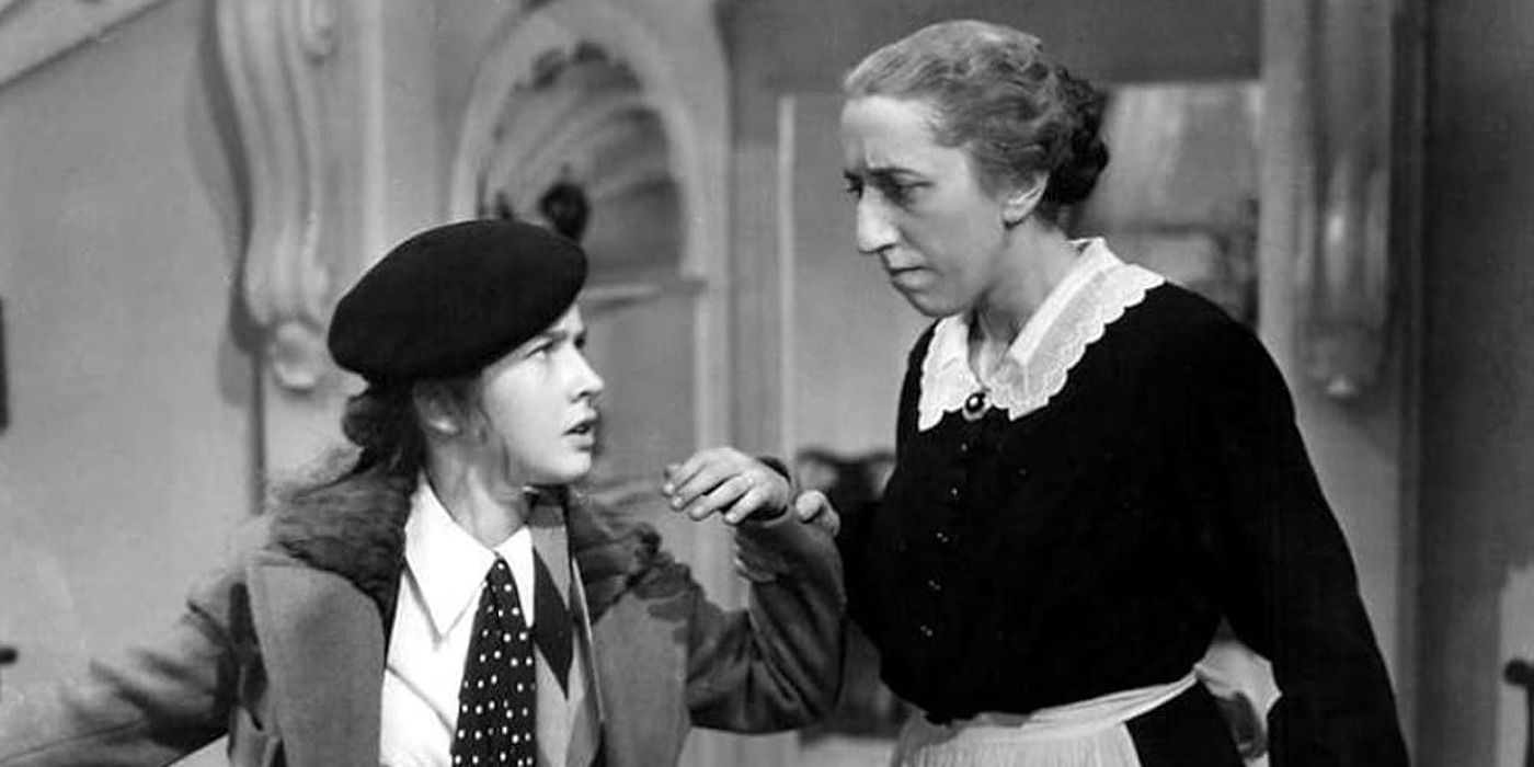 A woman holding Bonita Granville&rsquo;s hand in &lsquo;These Three&rsquo;