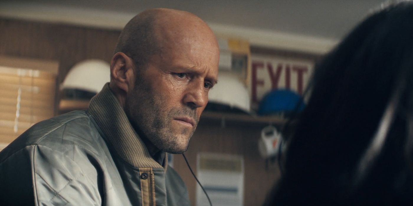 Jason Statham as Levon Cade in an office in A Working Man.