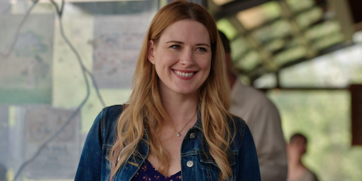 Alexandra Breckenridge as Mel Monroe smiling widely and looking at someone off-screen in Virgin River.