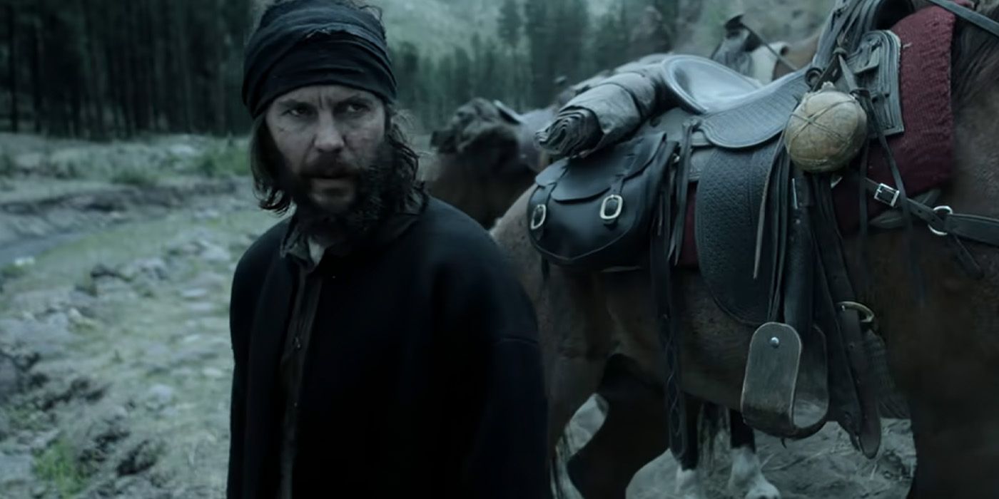 Taylor Kitsch as Isaac Reed looks back beside his horse on 'American Primeval'