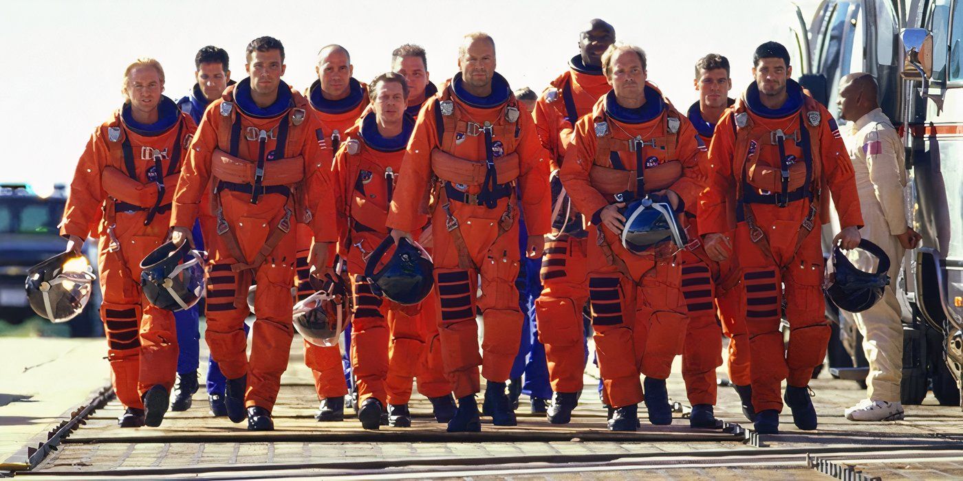 A team of oil drillers, led by Harry (Bruce Willis) walk towards the spaceship in their spacesuits in 'Armageddon'