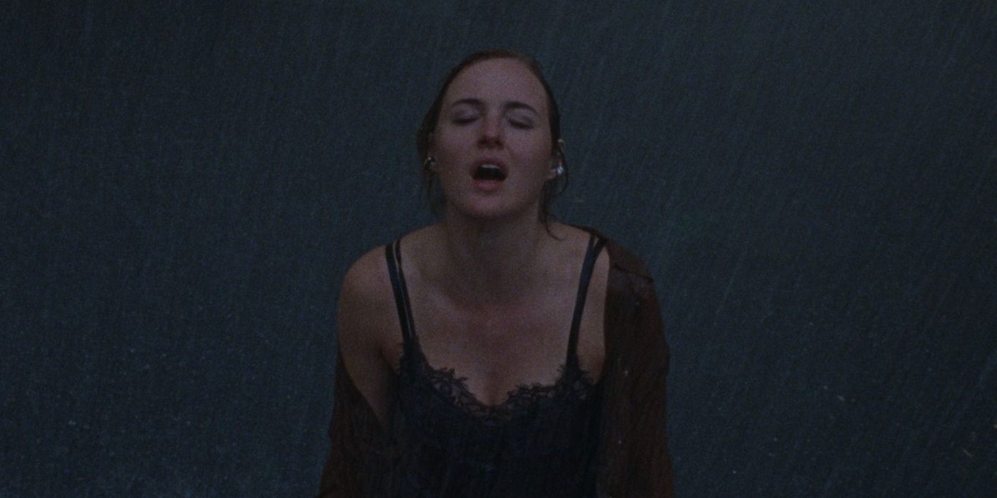 Renate Reinsve standing in the rain in &lsquo;Armand&rsquo;