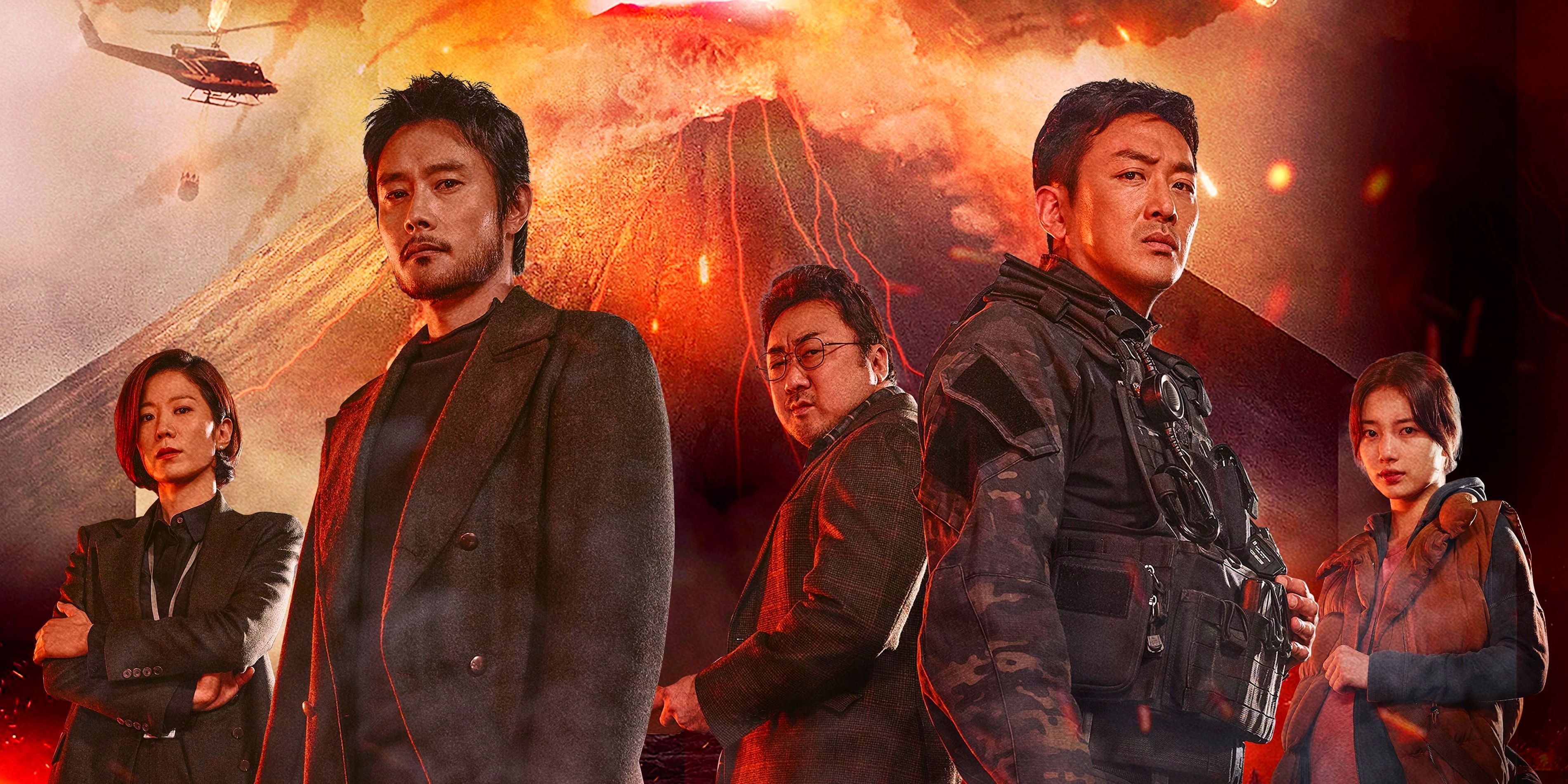 Three men, one in police gear, stand in front of an erupting volcano with two women on either side of them as a helicopter flies in the background.