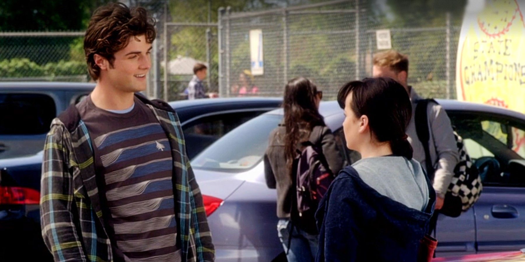 Matty McKibben and Jenna Hamilton talking to each other in the school parking lot in Awkward Season 2