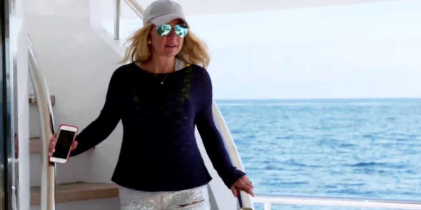 &lsquo;The Real Housewives of Dallas&rsquo; star Kary Brittingham walks down stairs holding a phone on &lsquo;Below Deck.'